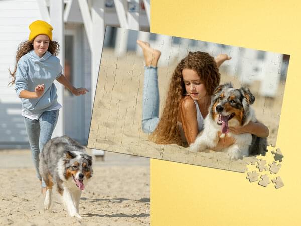 Fotopuzzle mit 264 Teilen von einem Kind mit Hund am Strand.